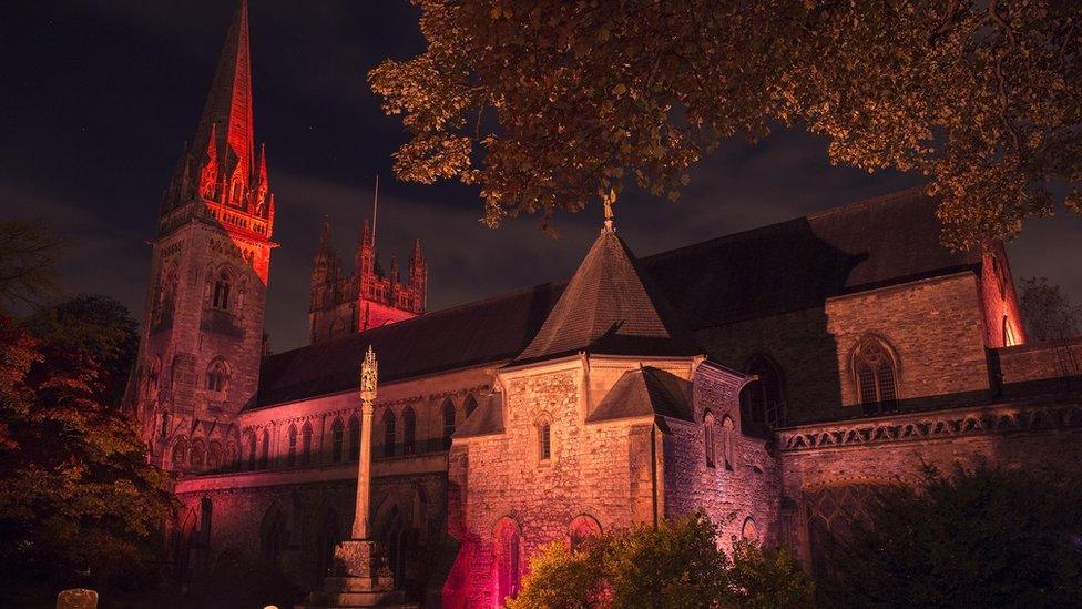 Llandaff Cathedral lit up in red light