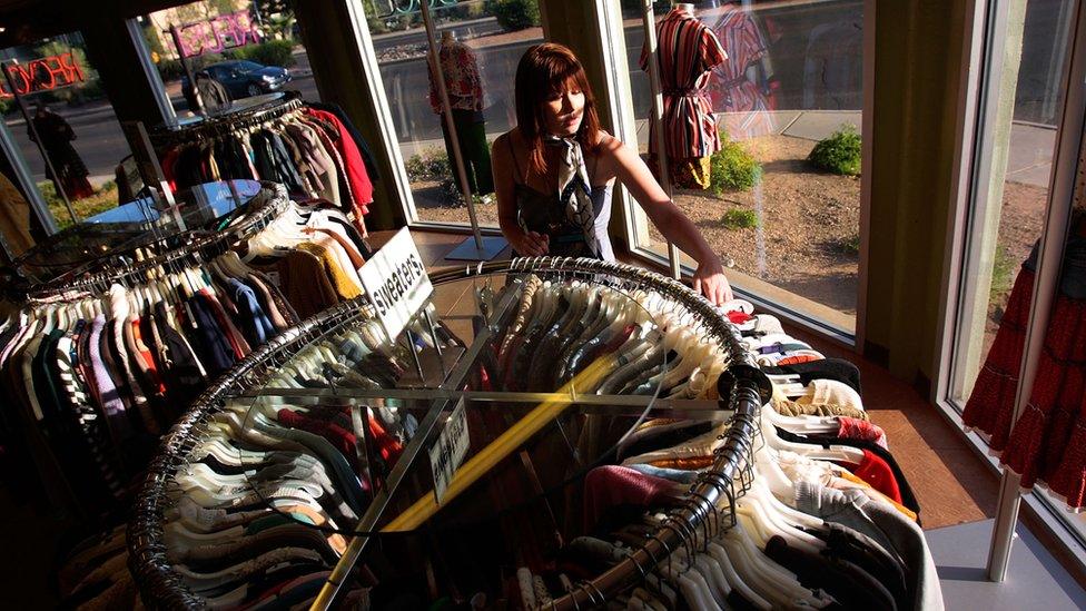 Linda Hjorth of Tucson mills through sweaters at Buffalo Exchange, a second hand clothing chain,