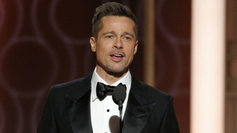 This image released by NBC shows presenter Brad Pitt at the 74th Annual Golden Globe Awards at the Beverly Hilton Hotel in Beverly Hills on Sunday, January 8, 2017. (Paul Drinkwater/NBC via AP)