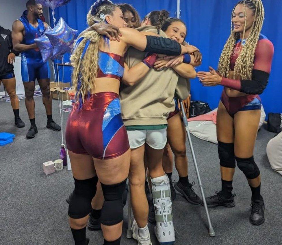 Ella-Mae Rayner meeting the other Gladiators on crutches