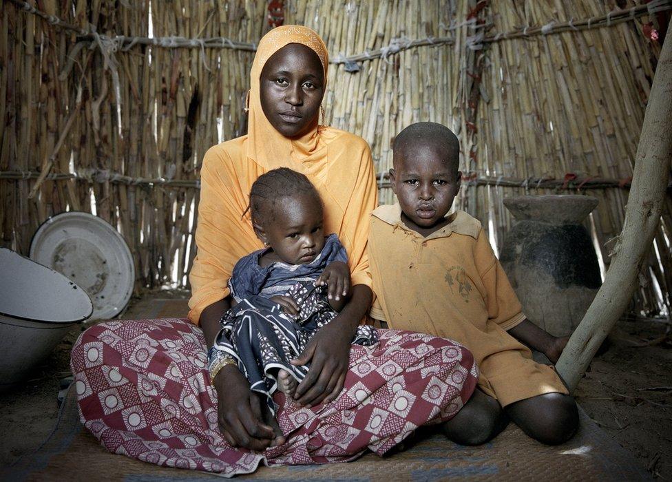 chelou Bossomi, 20, with her 18-month-old daughter Khalfoumi, and son Abba, 4, IDP camp on the outskirts of Mémé