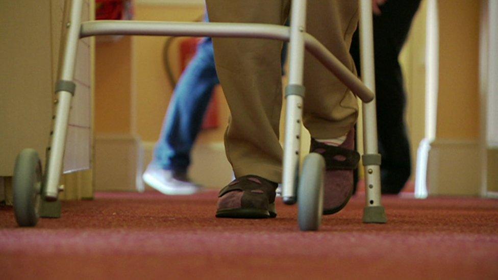 Man on walker in Care home