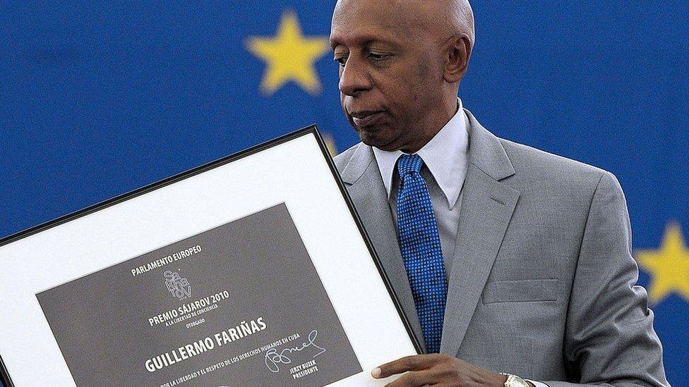 Cuban dissident Guillermo Fariñas on 3 July 2013, holding the 2010 Sakharov prize, a top human rights prize, in Strasbourg, eastern France