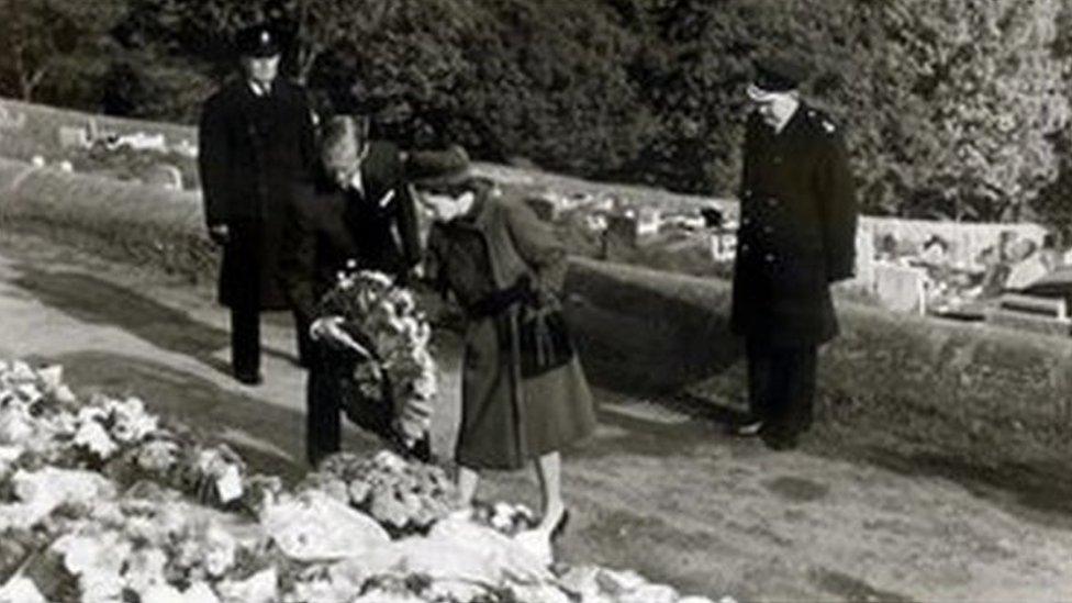 queen and duke of edinburgh leave floral tribute at memorial site