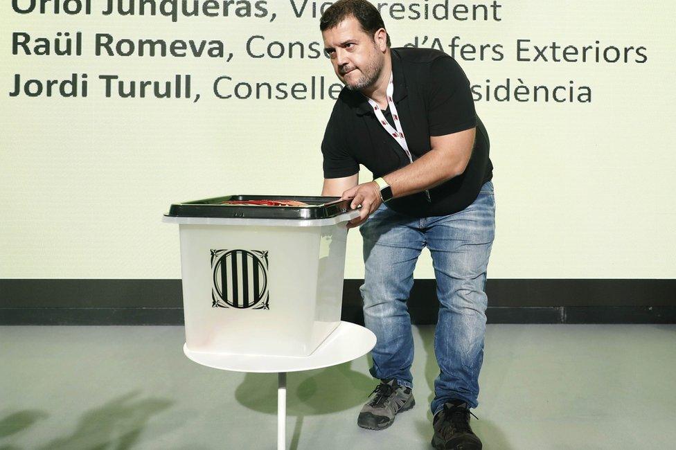 A ballot box is displayed during a press conference held by the Catalan government in Barcelona, 29 September