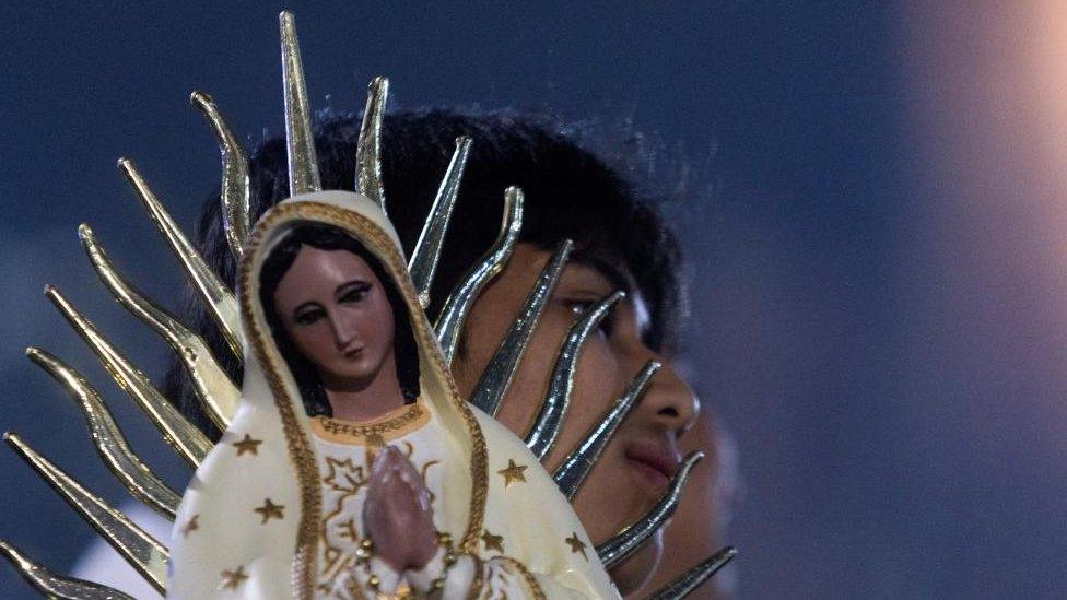 A Pilgrim walks to the Basilica of Our Lady of Guadalupe during the annual Virgin of Guadalupe feast day, in Mexico City, Mexico, December 12, 2023