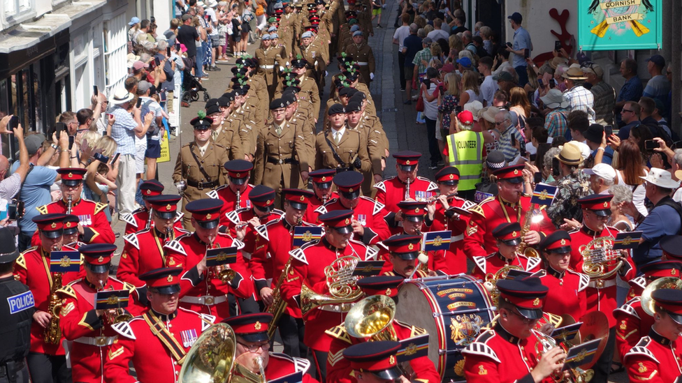 Soldiers marching in uniform through Falmouth