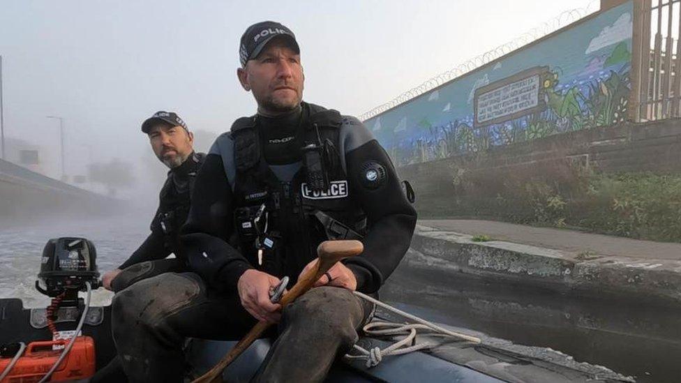 Two police officers on a boat