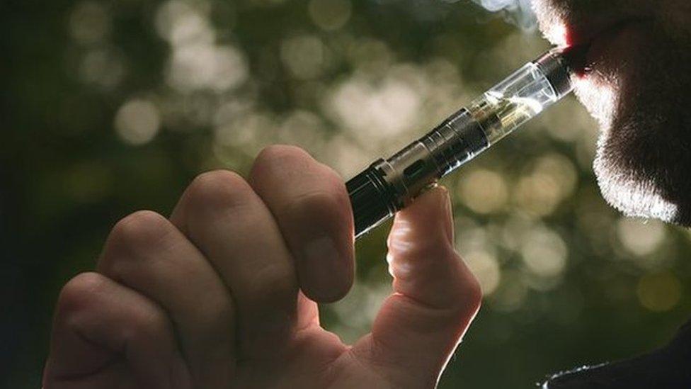 Close up of man smoking an electronic cigarette