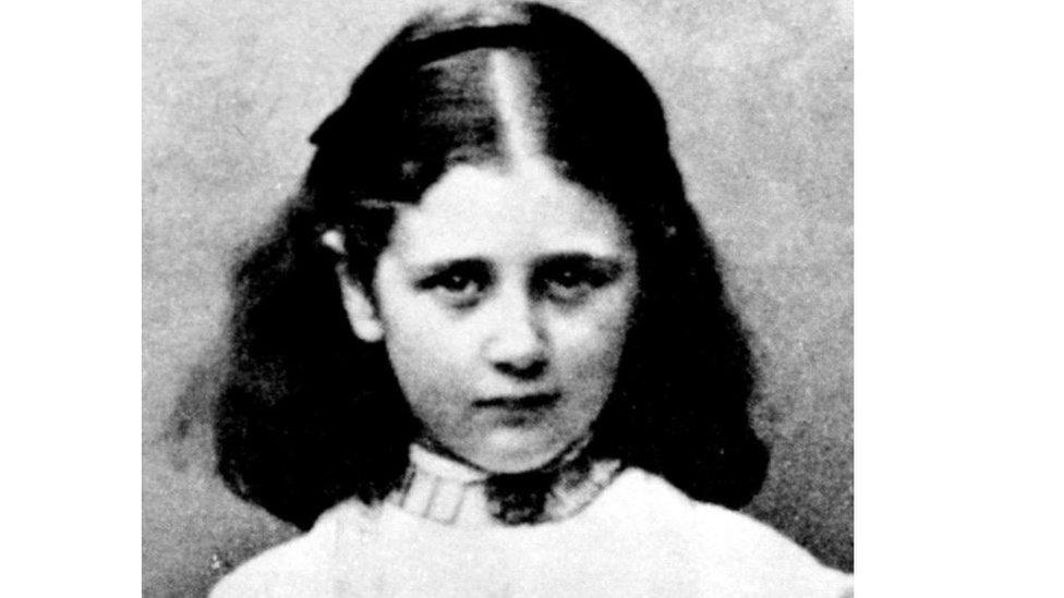 A black and white photograph of a young Beatrix Potter, aged nine