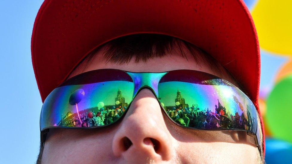 A boy watches the celebrations in Moscow