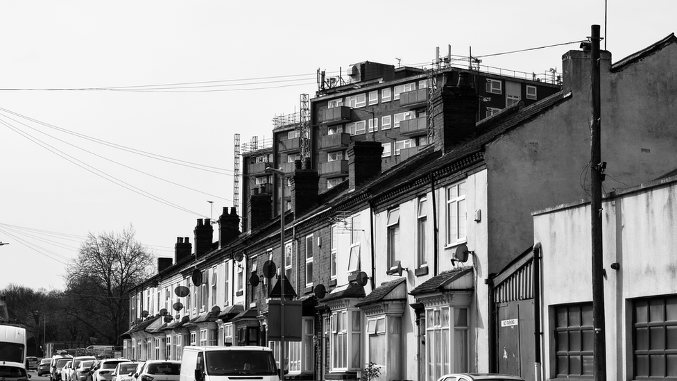 Row of terraced houses and satellite dishes