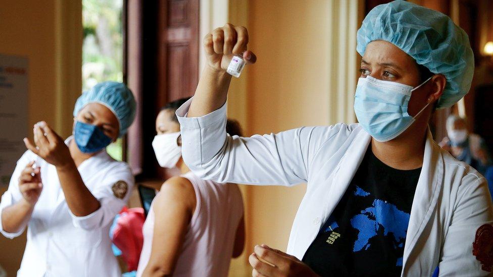 Nurse-in-training Julia Ramos prepares to vaccinate a person at a Covid-19 vaccination clinic at Museu da Republica in Rio de Janeiro