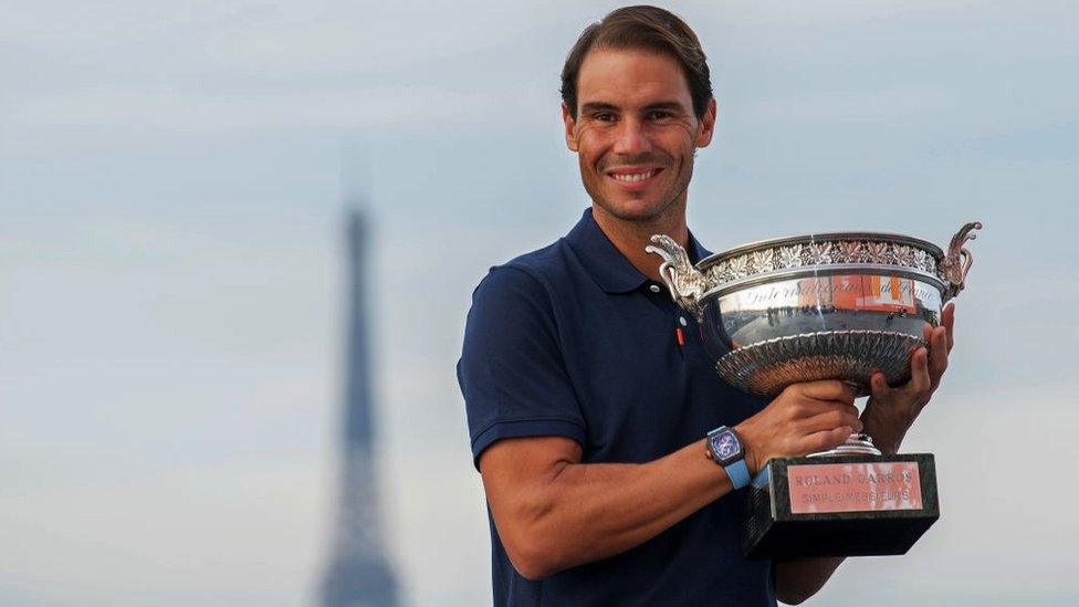 Rafael Nadal of Spain poses on the roof of Les Galeries Lafayette with Les Mousquetaires trophy following his victory in the French Open Men's Singles Finals 2020