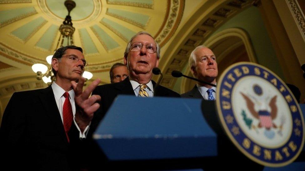 Senate Majority Leader Mitch McConnell, accompanied by Senator John Cornyn and Senator John Barrasso