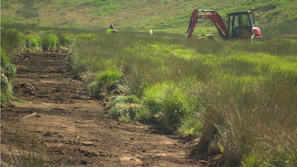 digger making a trench