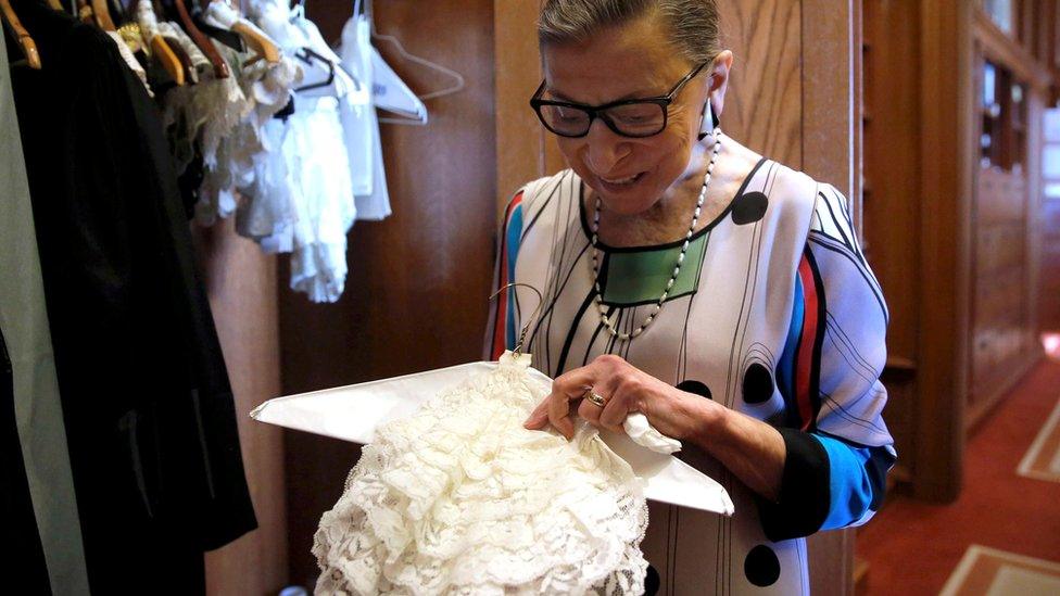 US Supreme Court Justice Ruth Bader Ginsburg shows the many different collars (jabots) she wears with her robes