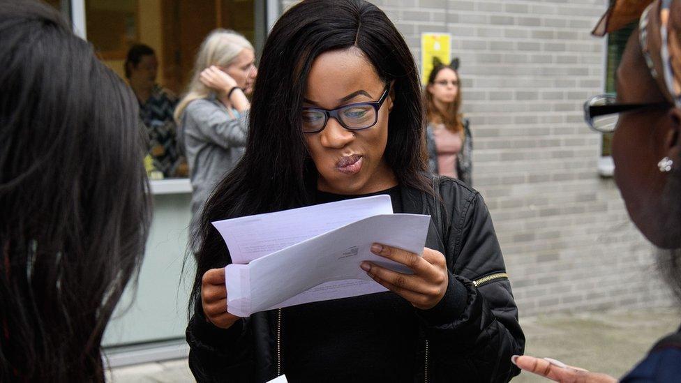 Student reads her A-level results