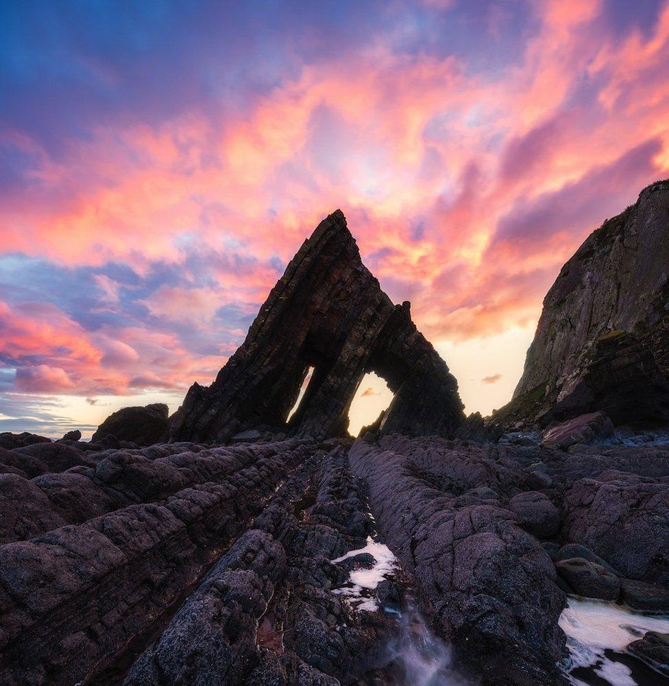 Landscape picture in Somerset with pink, blue and purple sky