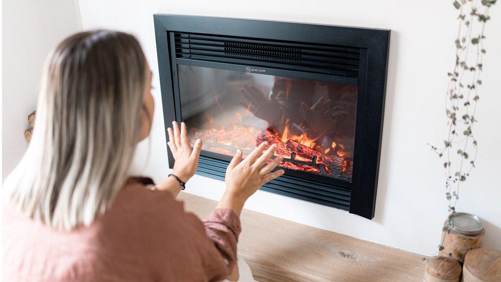 Woman heating her home