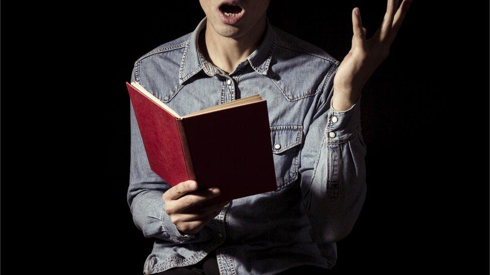 actor reading a book