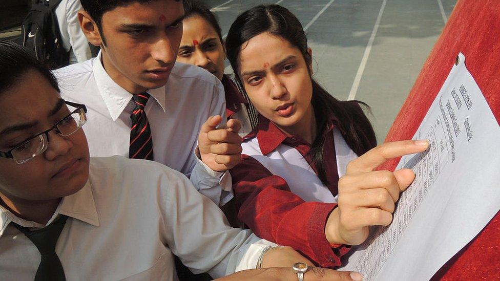 Students check their test scores