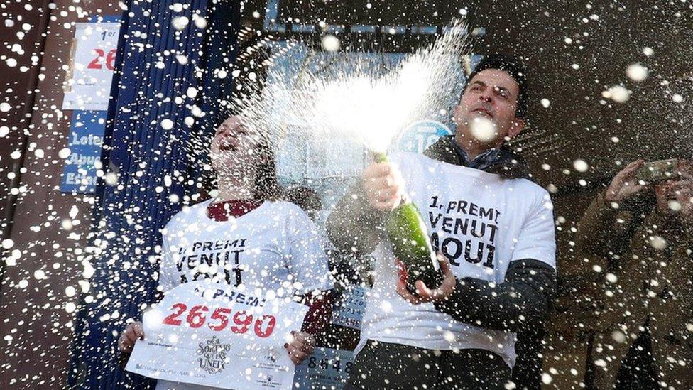 Laura Puentes and her husband Pablo celebrate selling the winning ticket of the biggest prize in Spain's Christmas lottery "El Gordo" (The Fat One) in Barcelona, Spain, 22 December, 2019.