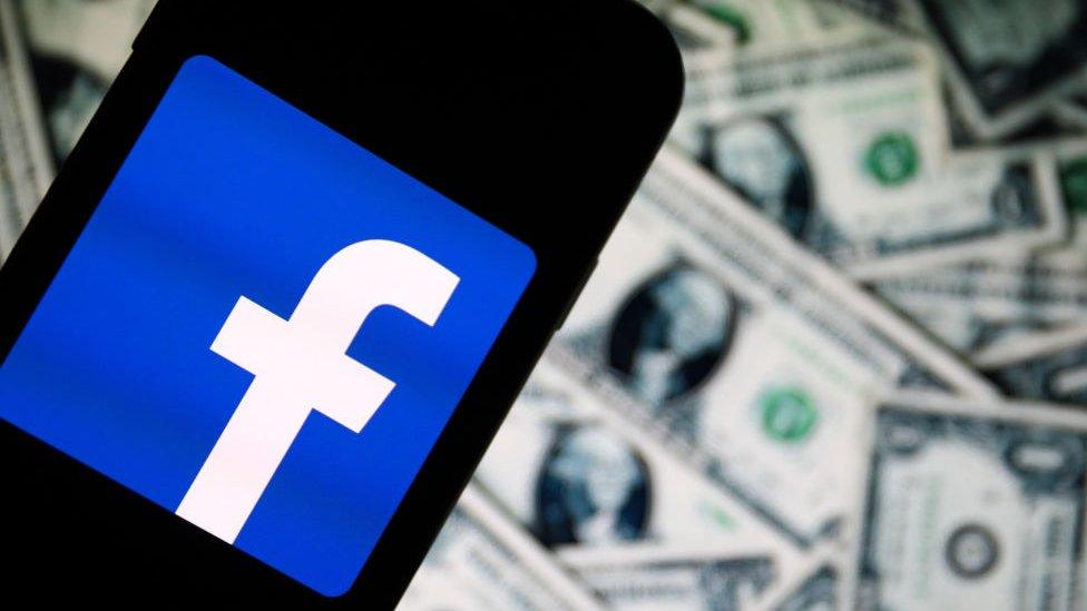 Facebook logo and dollars