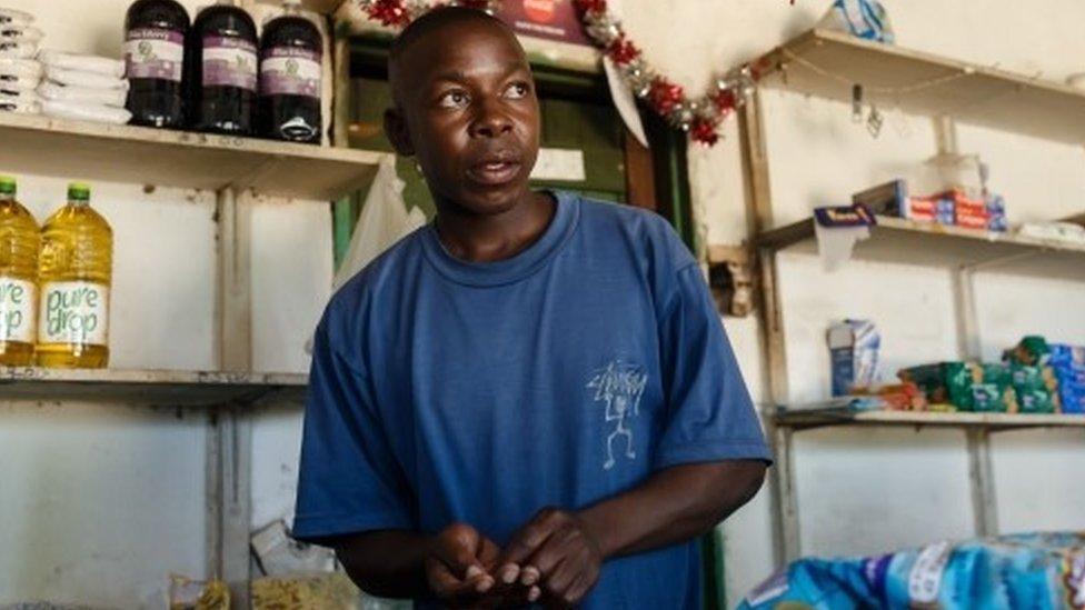 Solomon Chakauya, waits for customers in his grocery store, in Chinamhora district north-east of Zimbabwe's capital Harare on December 10, 2018.