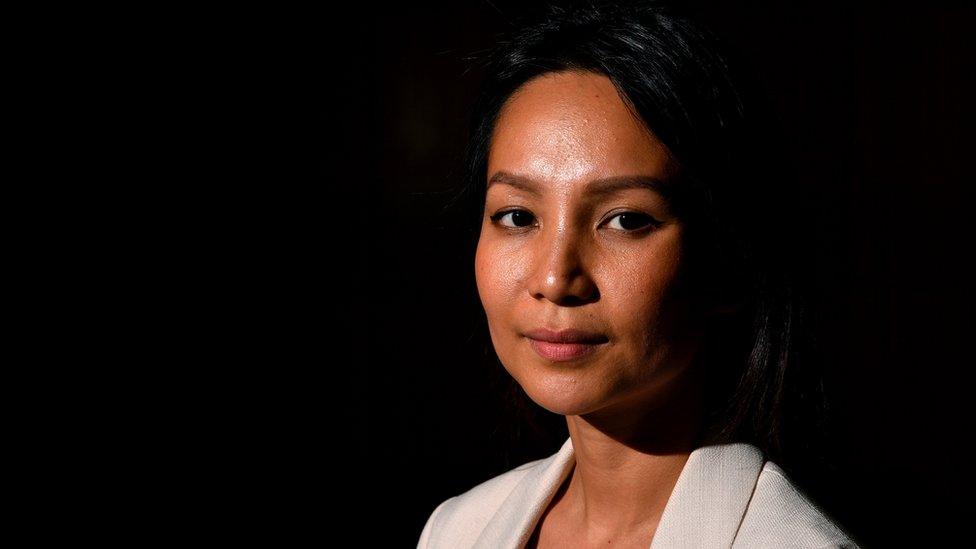 Monovithya Kem poses for a photograph following a press conference with NSW Opposition Leader Luke Foley at Parliament House in Sydney