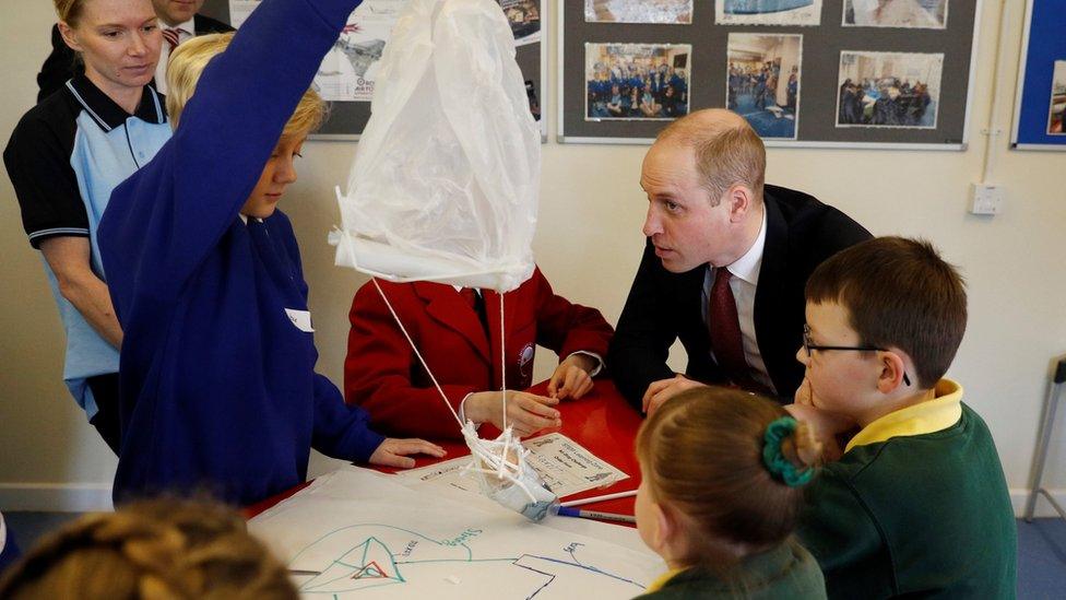 Prince William talking to school children