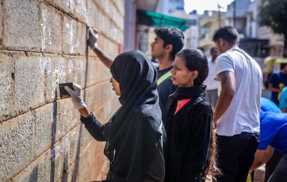 Volunteers working on the wall