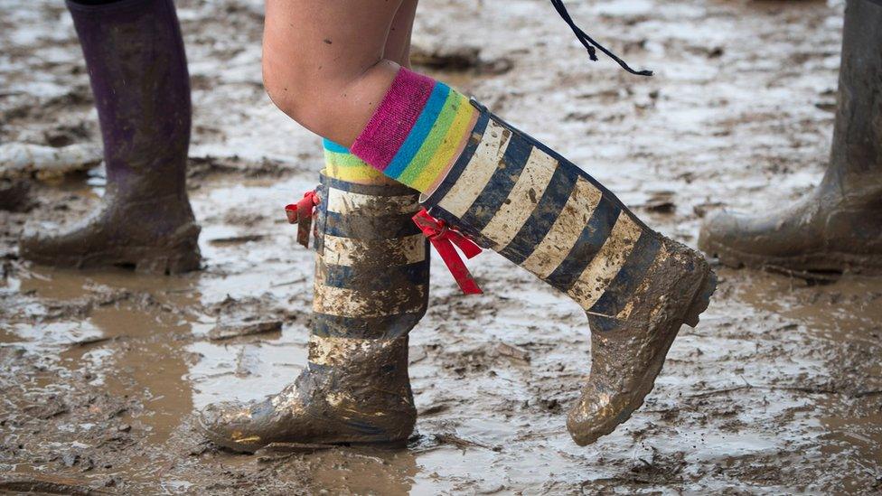 A muddy punter at Glastonbury