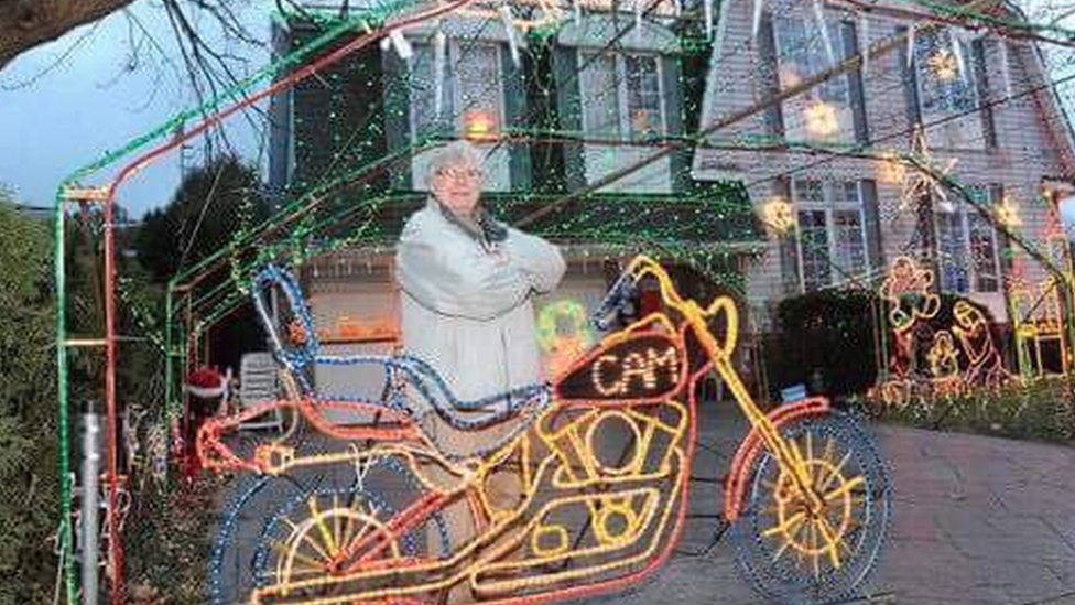 Doug Musson by the Harley light sculpture he created to honour his son Cam