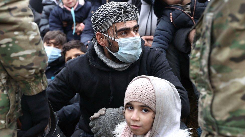 Migrants at Belarusian border with Poland