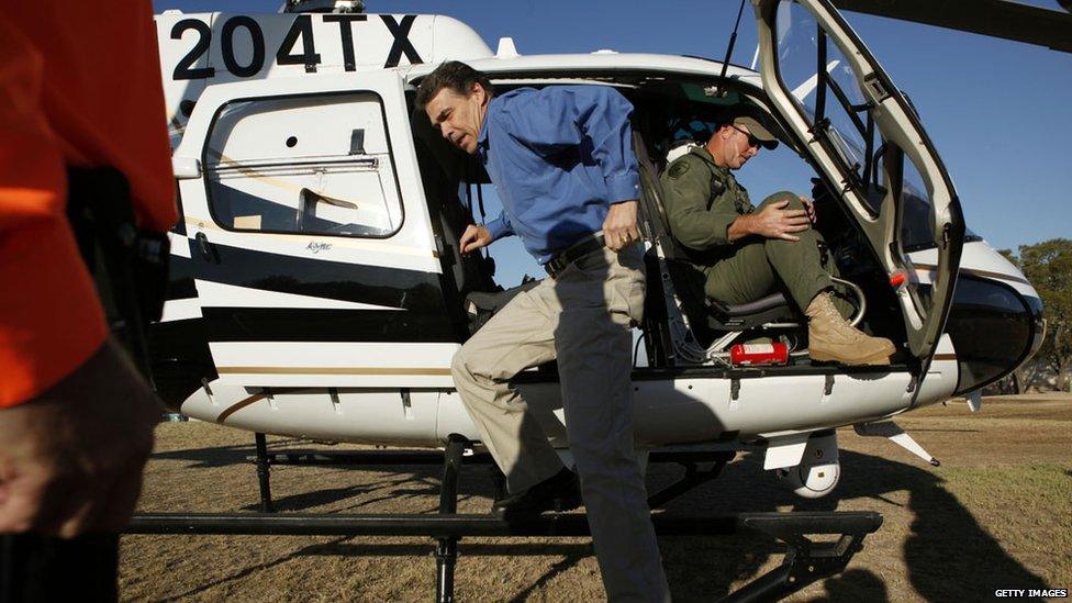 Rick Perry leaves helicopter after looking at wildfire destruction in 2012