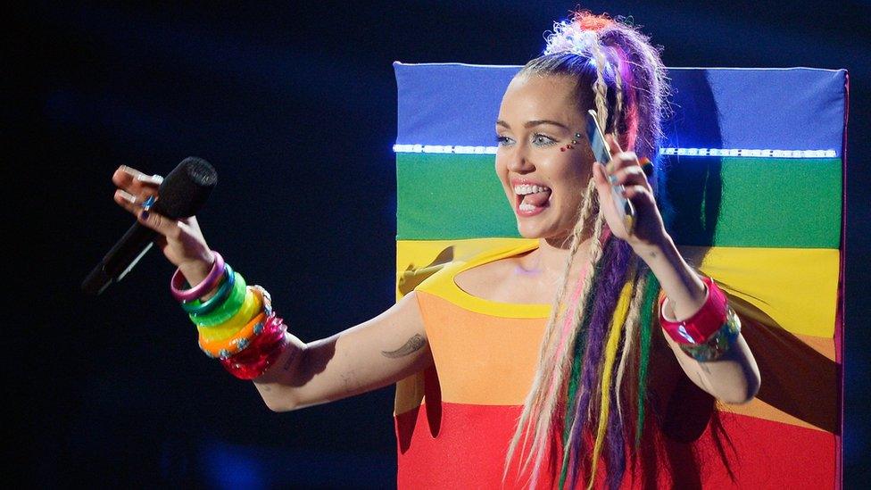 Host Miley Cyrus holding a Samsung phone speaks onstage during the 2015 MTV Video Music Awards at Microsoft Theater on August 30, 2015 in Los Angeles, California.