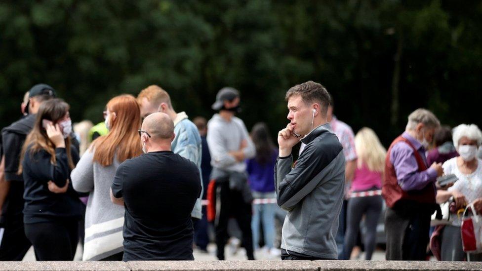 People queue at the test centre