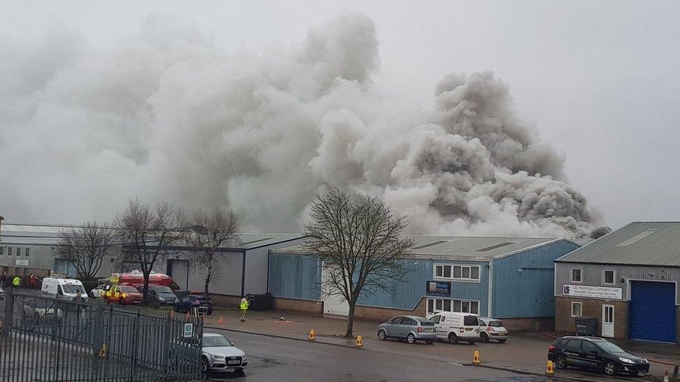 Plumes of smoke rising from industrial unit at Rackheath