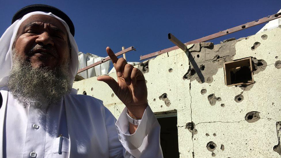 Saudi villager showing the BBC damage from a rocket attack from rebels in Yemen the day before