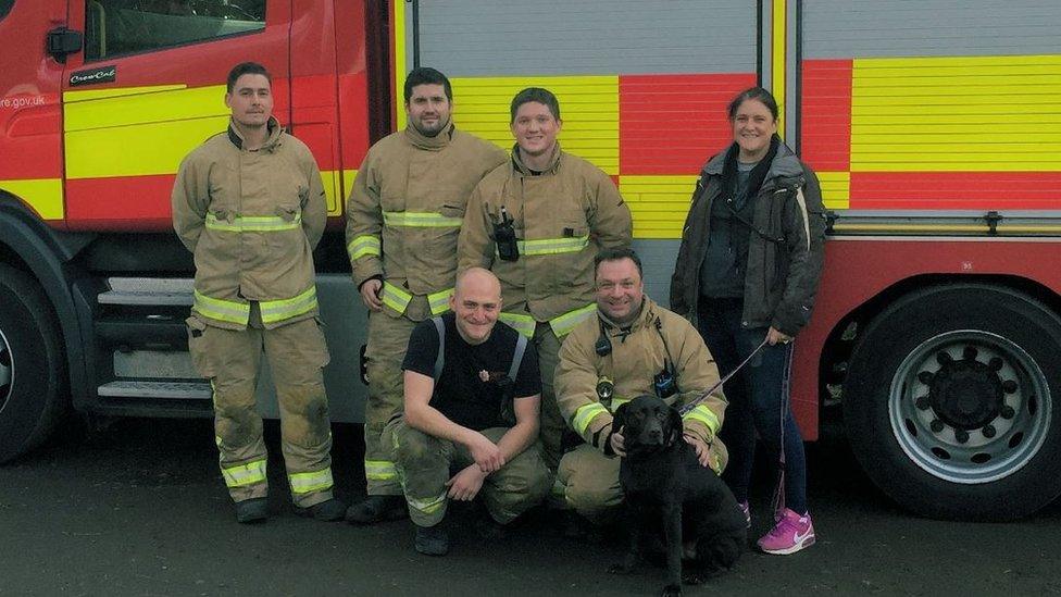 Corringham firefighters pose for a picture with Remi