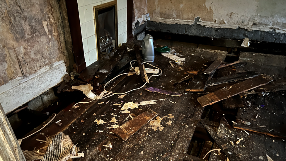 Torn up floorboards