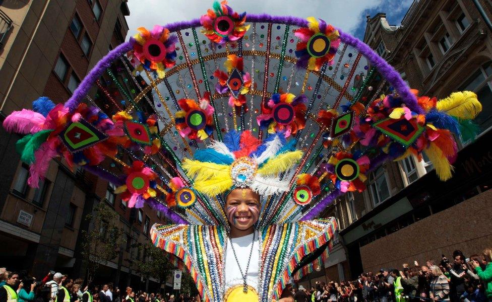 A performer dances in the street parade at the annual Notting Hill Carnival