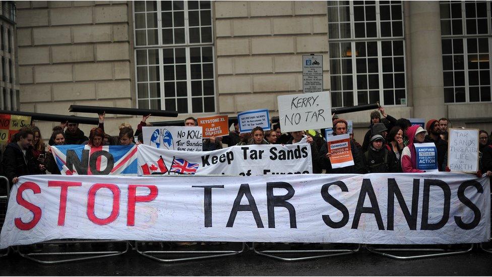 Protesters take part in a rally in central London on April 11, 2013 to demonstrate against the Keystone XL Tar Sands Pipeline as foreign ministers from the G8 group of nations meet nearby.