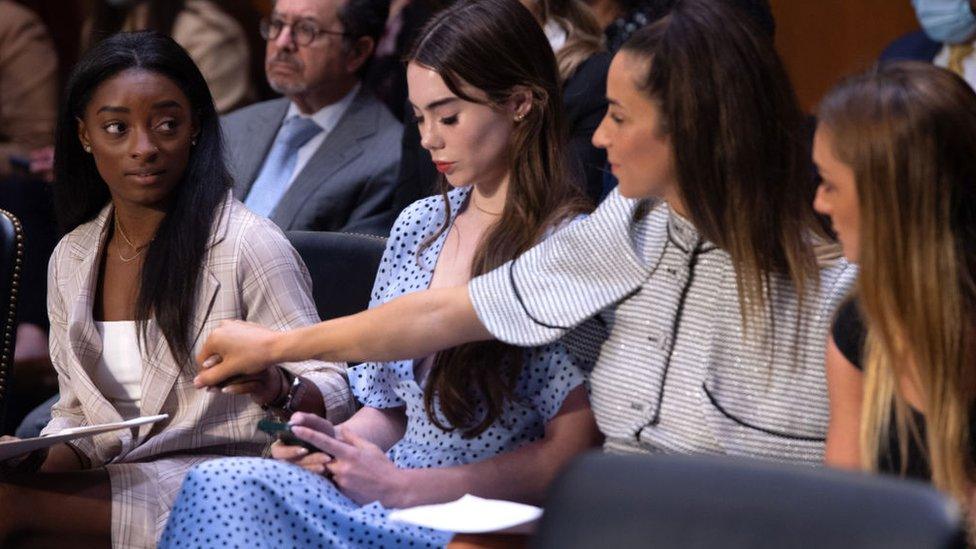 US gymnasts (L-R) Simone Biles, McKayla Maroney, Aly Raisman and Maggie Nichols arrive to testify during a Senate Judiciary hearing about the Inspector General's report on the FBI handling of the Larry Nassar investigation of sexual abuse of Olympic gymnasts, on Capitol Hill, September 15, 2021, in Washington, DC.