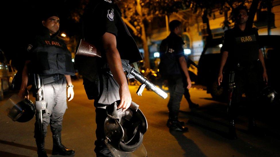 Security personnel keep watch, after gunmen stormed the Holey Artisan restaurant and took hostages, in the Gulshan area of Dhaka, Bangladesh July