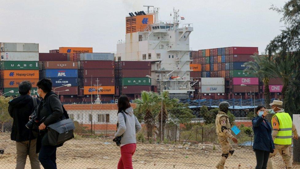 A container ship moves through the Suez Canal, in Ismailia, Egypt (30 March 2021)