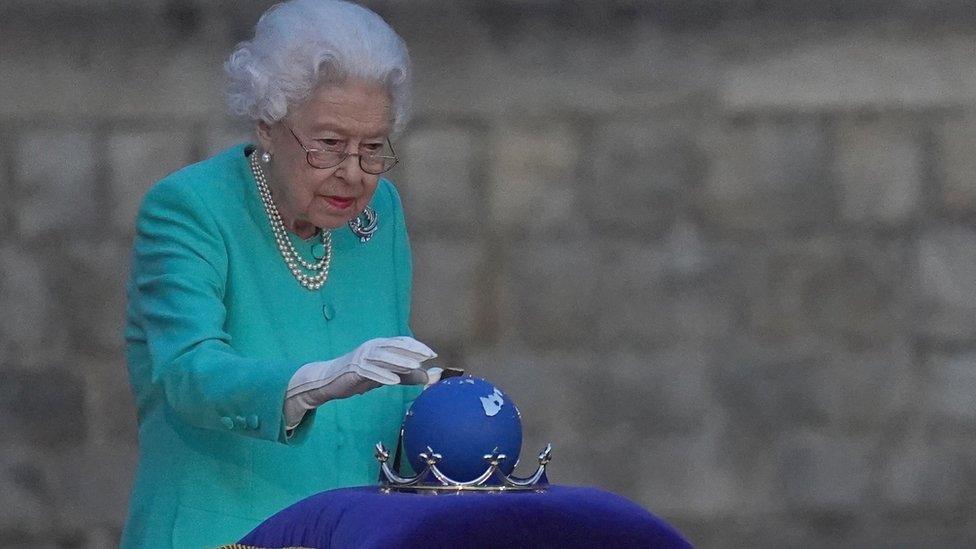 Queen with globe