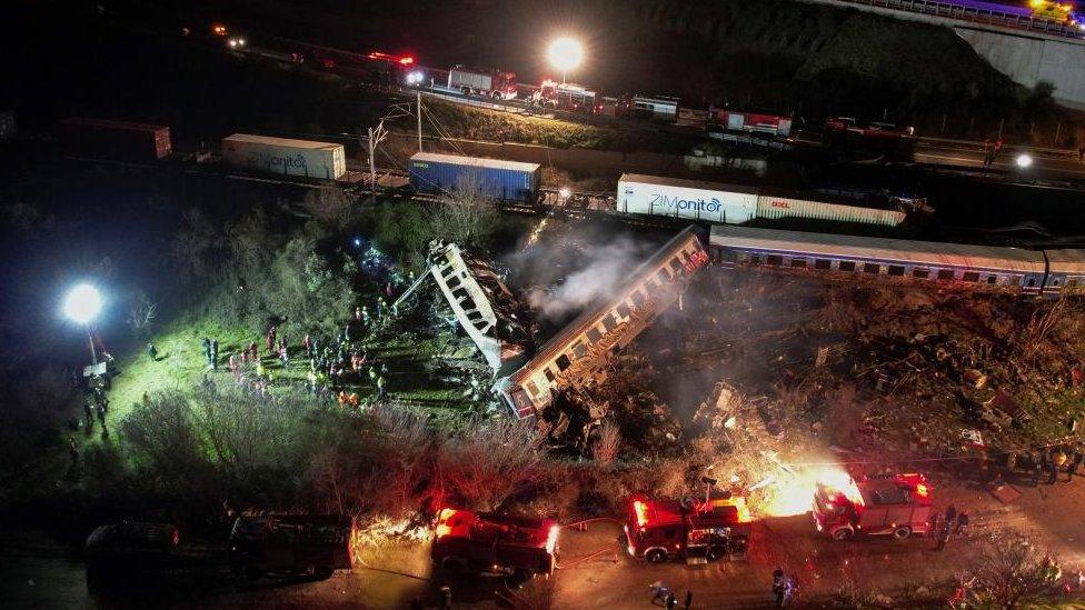 Rescue workers around train