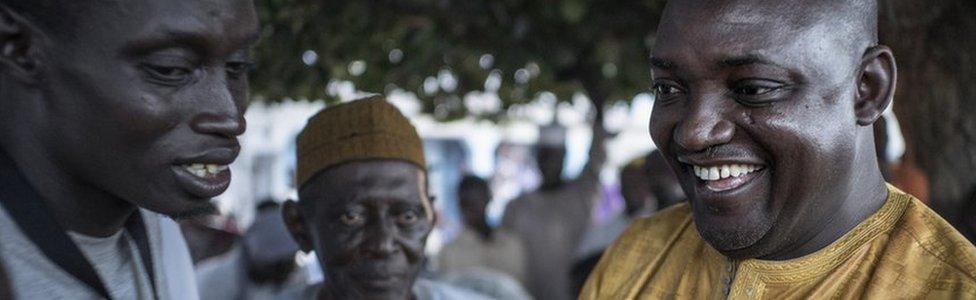 Adama Barrow chats with voters